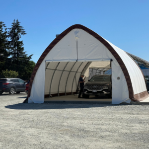 A fabric-covered car wash bay installed at a Hyundai dealership, providing a dedicated, weather-protected space for vehicle detailing and maintenance.